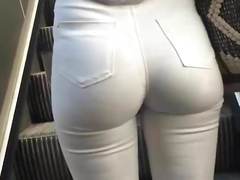 Hot teen on escalator in tight white jeans