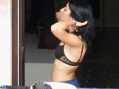 Neighbor in black bra on the balcony