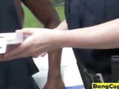 Black dude with huge cock fucked hard by a two female cops inside the truck