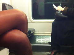 Commuter classy lady display crossed legs in train