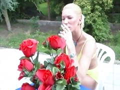 Shaved blonde smokes cigarette and fucks outdoors
